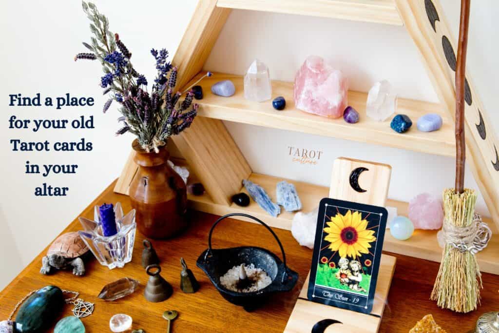 Spiritual altar with a ceramic turtle, gemstons and crystals, inciense, lavender, a small broom and a Tarot card, with the caption: "Find a place for your old Tarot cards in your altar"