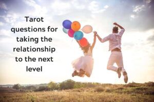 Couple jumping in a field, on a sunny day, she with a bunch of balloons in her hand, with caption "Tarot questions for taking the relationship to the next level"